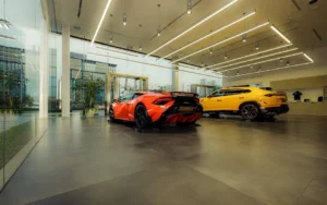 Luxury sports cars in modern showroom.